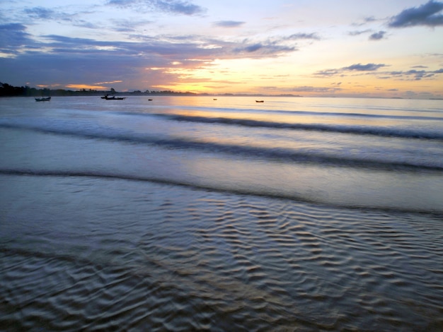 Fishing boat in the sea at sunrise   