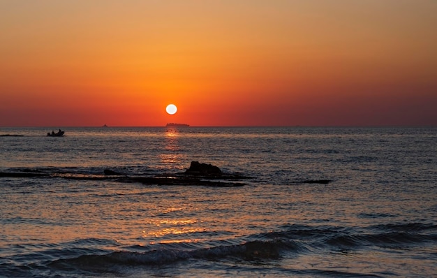 fishing boat in the sea at sunset in Israel