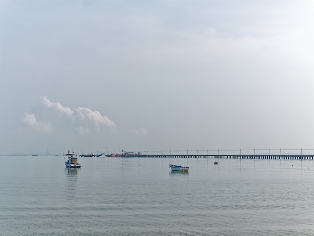 Fishing Boats Floating on the Sea at the Pier