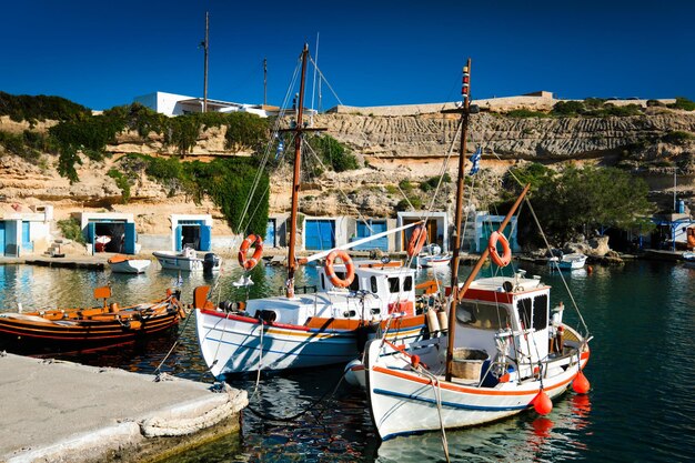 Fishing boats in harbour in fishing village of Mandrakia Milos island Greece