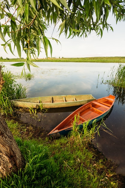 Fishing boats moored at the riverbank