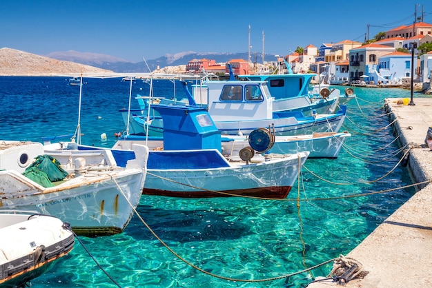 Fishing boats in port in island Halki Chalki in Greece