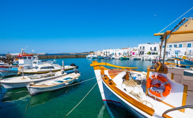 Fishing boats tied up at a dock in Naoussa port Greece