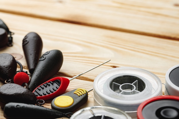 Fishing gear on wooden background close up photo