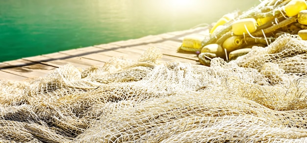 Premium Photo  Fishing net on the pier background with sun flare