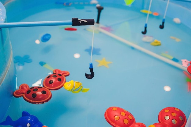 Premium Photo  Fishing in the paddling pool children's toys in the pool  toy fish fishing rod cheerful children fishing fishing in the paddling pool