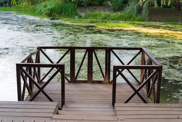 Fishing pier on the river on a summer day