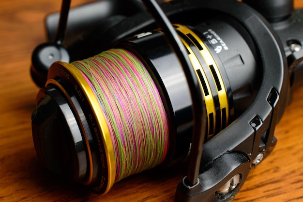 Fishing reel with colorful line.