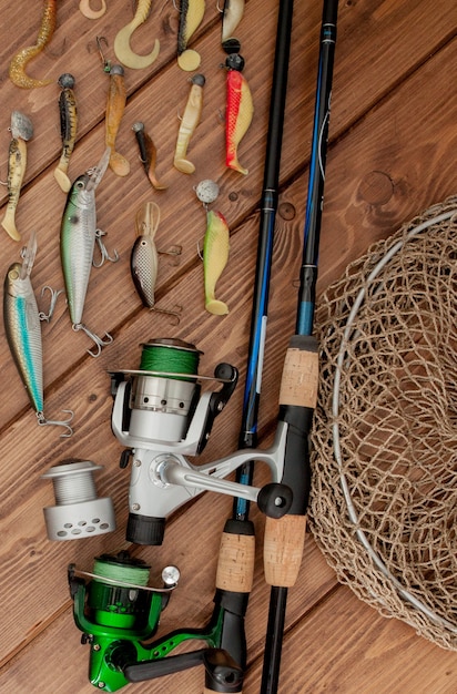 Fishing tackle - fishing spinning, hooks and lures on wood