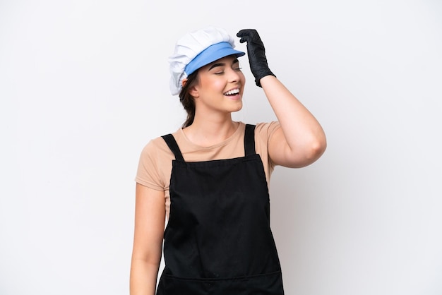 Fishmonger brazilian woman wearing an apron isolated on white background has realized something and intending the solution