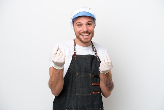 Fishmonger man wearing an apron isolated on white background making money gesture