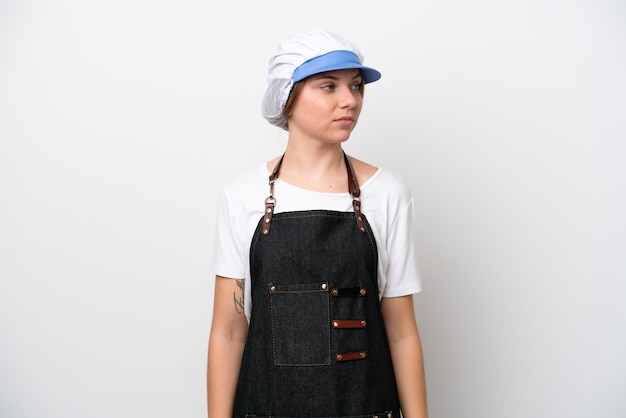 Fishmonger woman wearing an apron looking to the side