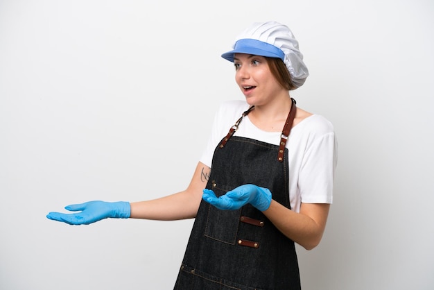Fishmonger woman wearing an apron with surprise expression while looking side