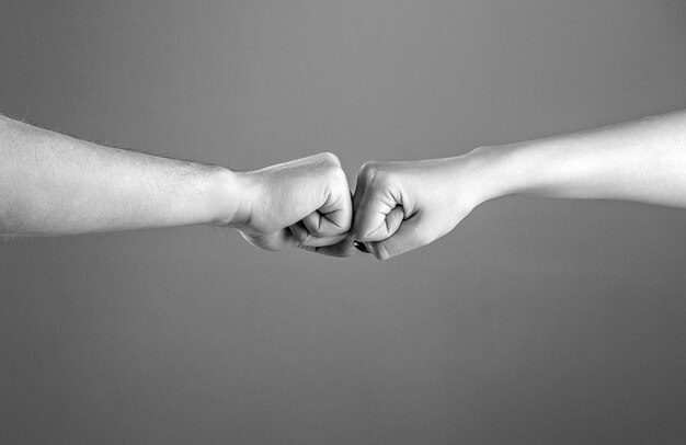 Fist Bump Clash of two fists vs Gesture of giving respect or approval Friends greeting Teamwork and friendship Partnership concept Black and white