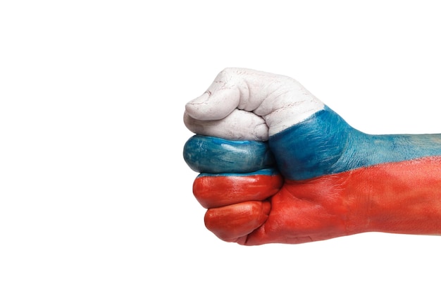 Fist hand is painted in colors flag Russian Federation on a white background of isolate