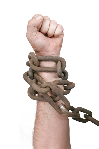 Photo fist of man in chains isolated