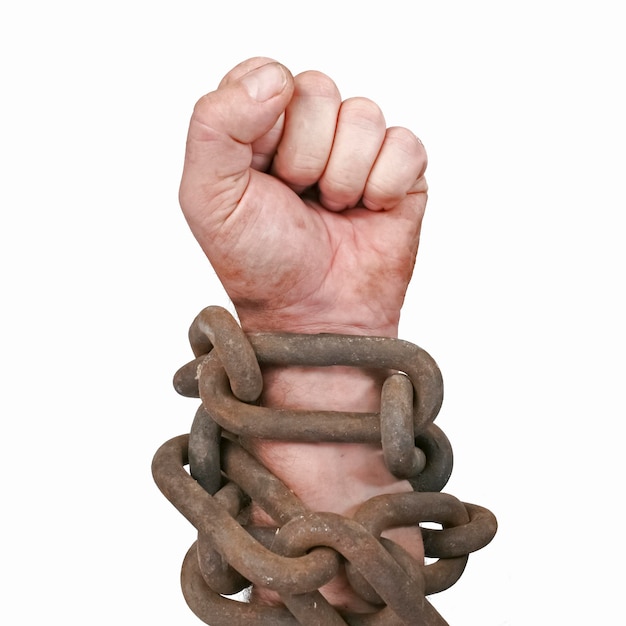 Fist of man in chains Isolated