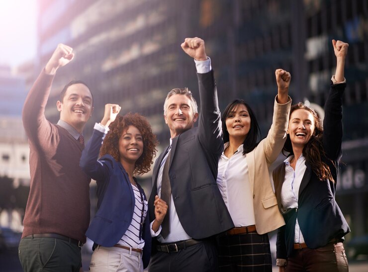 Photo fist pump happy and portrait of business people in city for teamwork achievement or winning smile group and professional lawyers with celebration hand gesture for collaboration in urban town