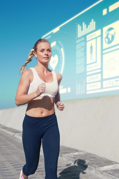 Fit blonde joggen op de pier tegen fitness-interface