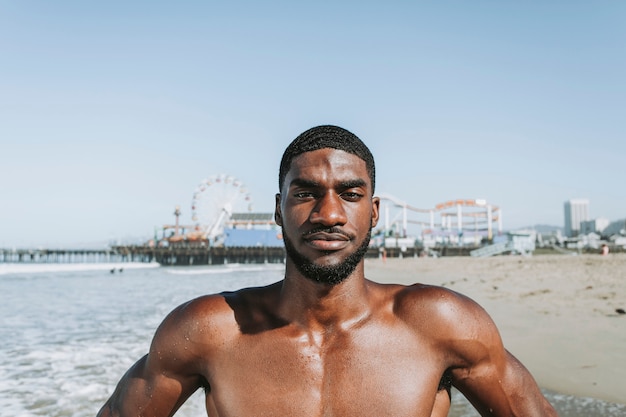 Fit man posing at the beach