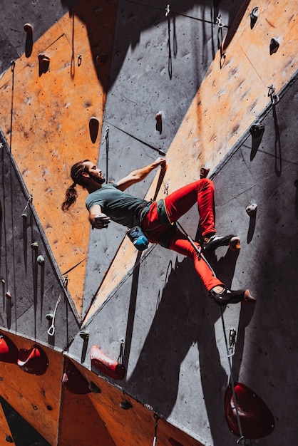 Fit man practicing rock climbing