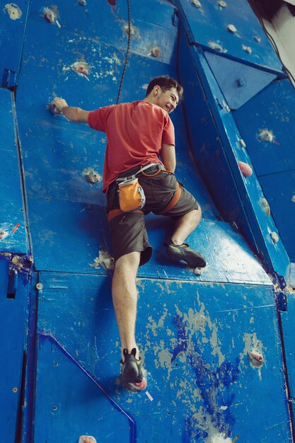 Fit man rock climbing