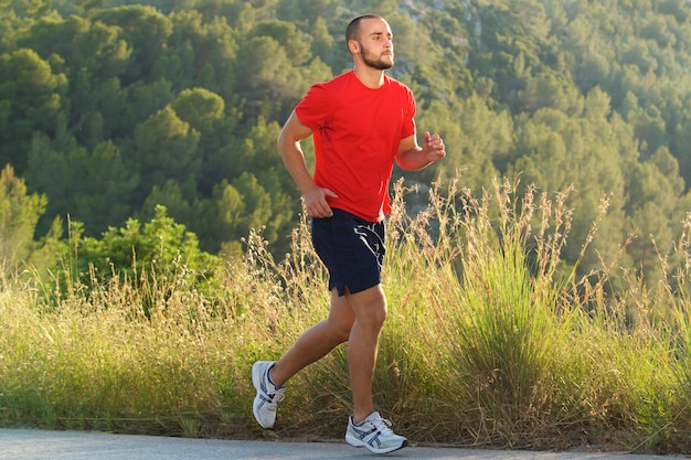 Fit man running outdoors 