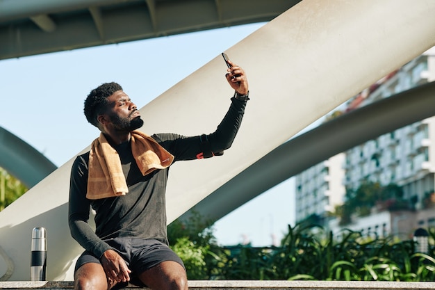 Fit man taking selfie