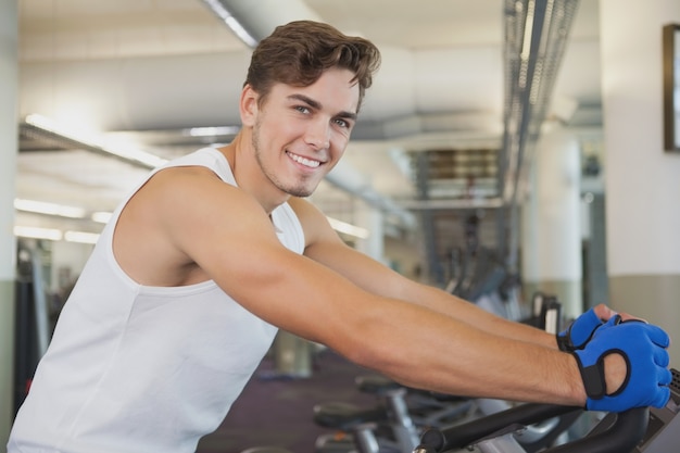 Fit man working out on the exercise bike