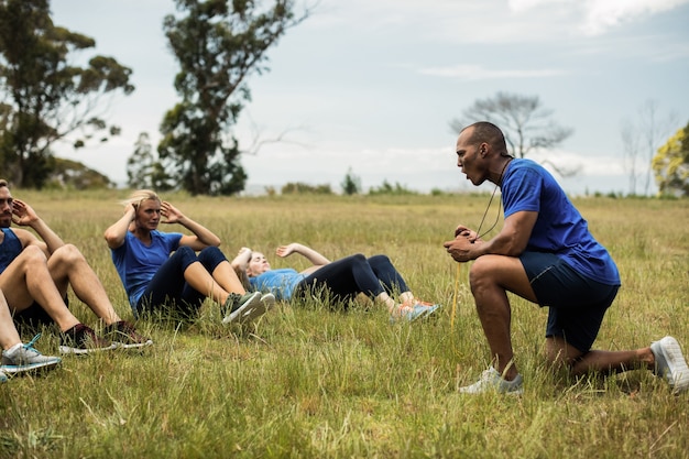 Fit people performing crunches exercise