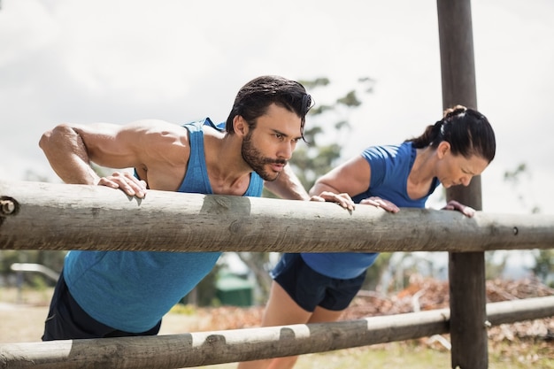 Fit people performing pushup exercise in boot camp