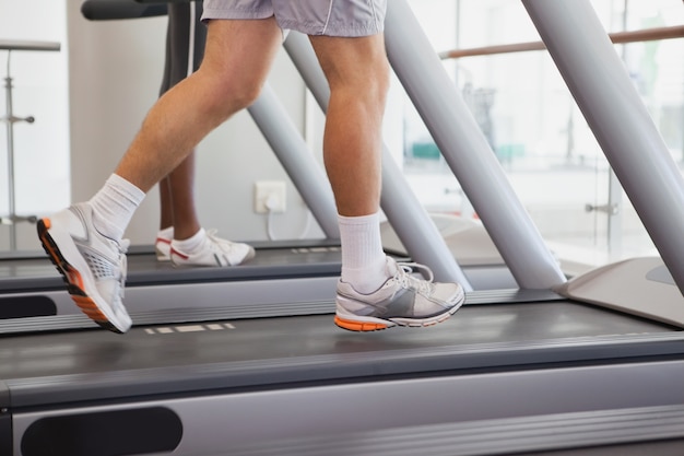 Fit people running on treadmills