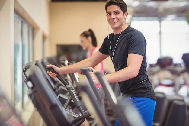 Fit people working out using machines