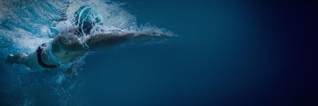 Fit swimmer training by himself