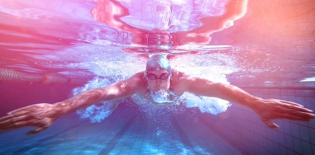 Fit swimmer training by himself