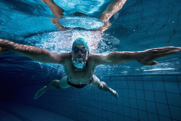 Fit swimmer training by himself