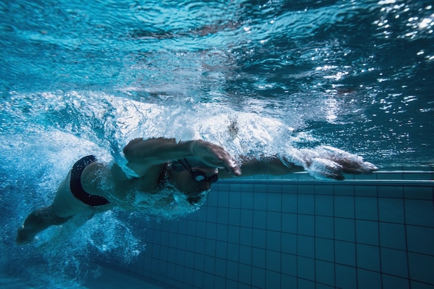 Fit swimmer training by himself