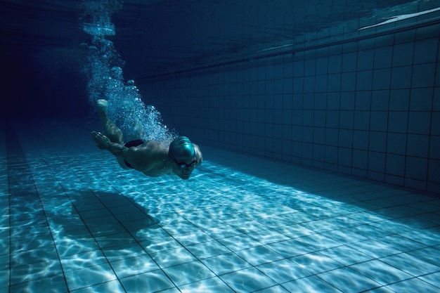 Fit swimmer training by himself