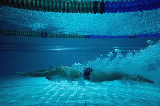 Fit swimmer training on his own