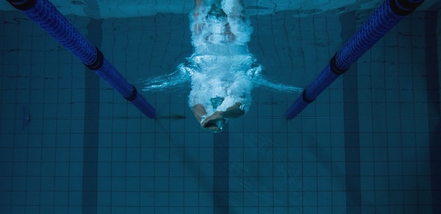 Fit swimmer training on his own