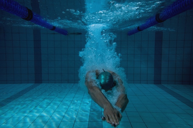 Fit swimmer training on his own