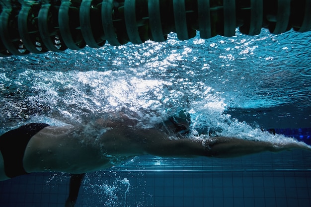 Fit swimmer training on his own