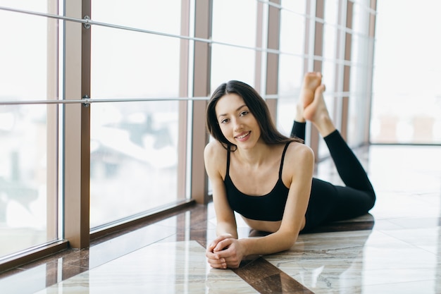 Fit woman lying on floor