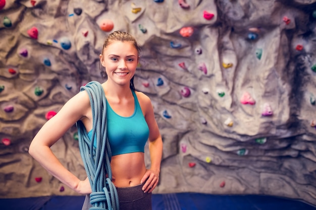 Fit woman at the rock climbing wall