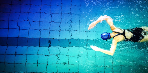 Fit woman swimming in the pool