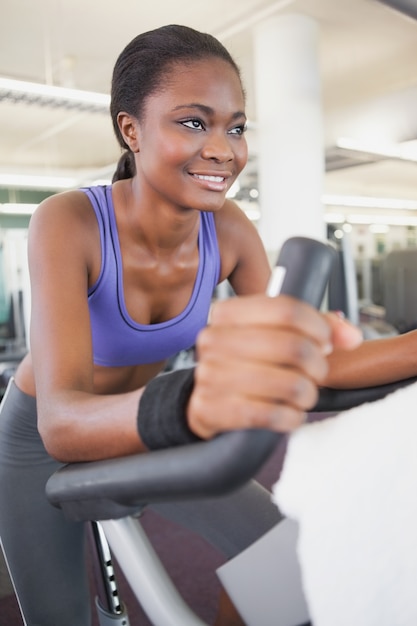 Fit woman working out on the exercise bike