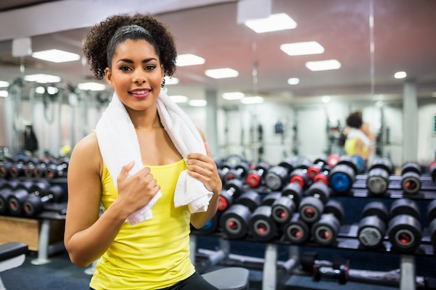 Fit woman working out in weights room