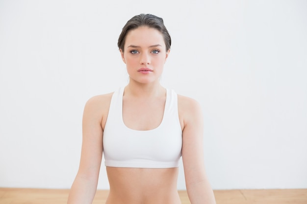 Fit young woman at fitness studio