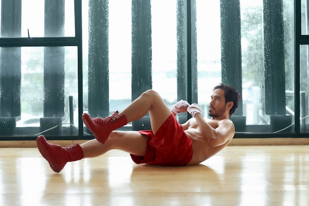 Fitness asian man doing exercise sit up