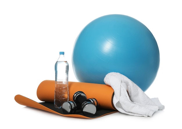 Fitness ball bottle of water and sport accessories isolated on white